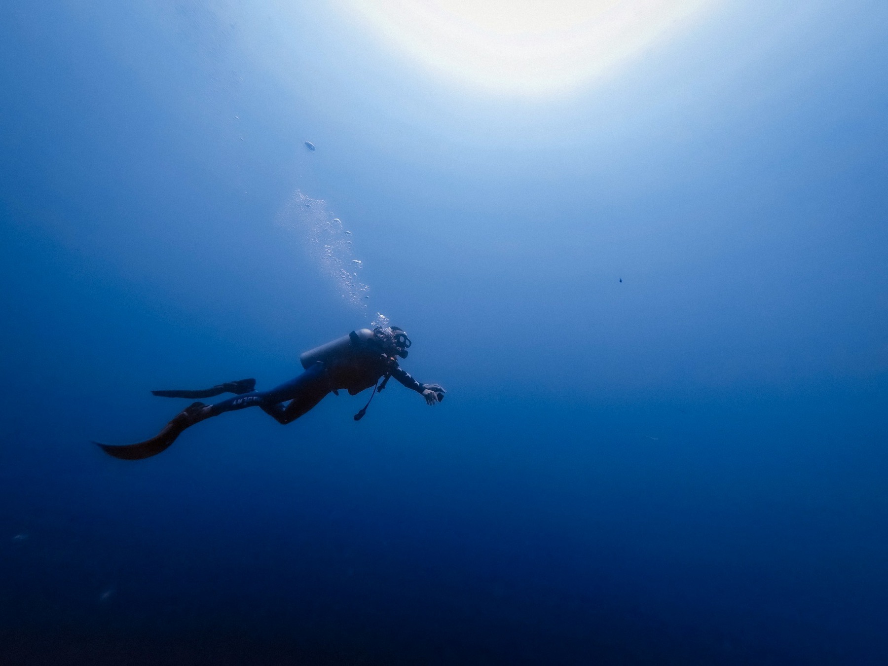 A diver exploring clear tropical water